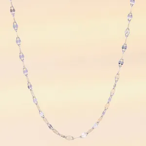 Close-up of minimalist silver flat rhombic leaf link necklace with metallic luster