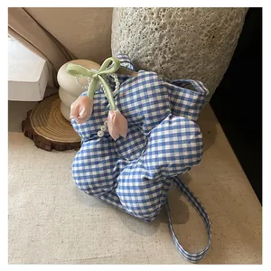 Detailed view of blue plaid flower tote bag with pearl chain and tulip charm