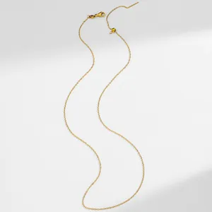 Detail of 18K gold plated stainless steel adjustable chain with lobster clasp and pin needle