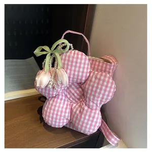 Detailed view of pink plaid flower-shaped canvas bag with pearl chain and tulip charm