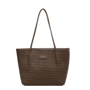 Large dark coffee woven tote bag with shoulder strap and embossed leather texture