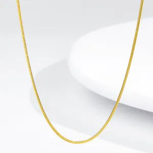 Detailed view of an 18K gold-plated stainless steel snake chain with smooth metal texture