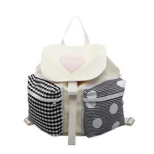 Large capacity off-white canvas backpack with pink heart and mixed pattern pockets