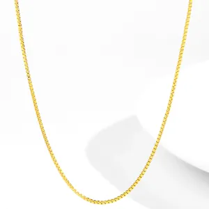 Detailed view of an 18K gold-plated stainless steel box chain with a smooth metallic shine
