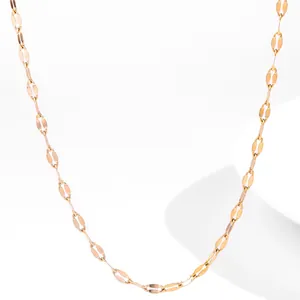 Detailed view of 18K gold plated stainless steel thin link necklace with oval metal discs