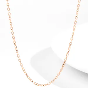 Macro shot of 18K rose gold stainless steel cable chain necklace with polished finish
