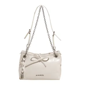 Large cream white shoulder tote bag with chain strap and bow detail on front