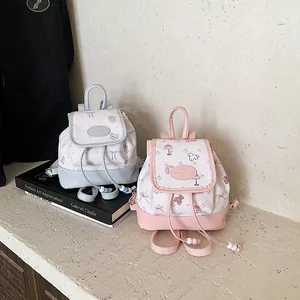 Mini floral drawstring bucket backpacks in light blue and pink with cute cartoon prints