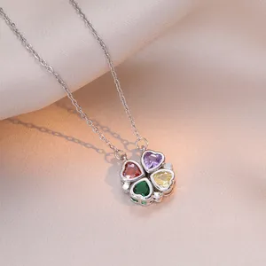 Creative silver necklace featuring four-leaf clover pendant with multi-color heart crystals