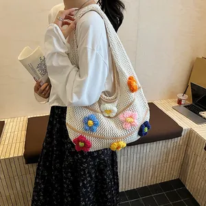 White crochet tote bag with colorful 3D knitted flowers for summer casual outfits