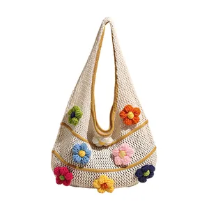 Handmade crochet tote bag featuring vibrant 3D floral decorations and white mesh knit