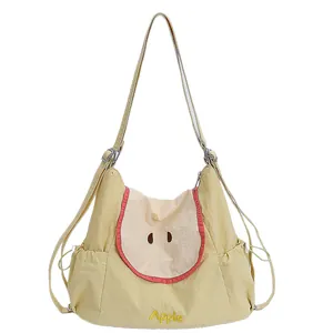 Cute apple-themed yellow tote bag with red fruit slice design and adjustable straps