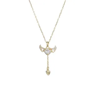 Gold-plated necklace featuring a winged heart pendant with clear zircon stones