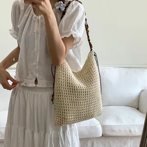 Handmade crochet shoulder bag with wooden beads and a spacious woven hollow design
