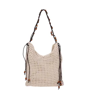 Beige crochet beach tote bag with wooden beads and bohemian woven mesh design