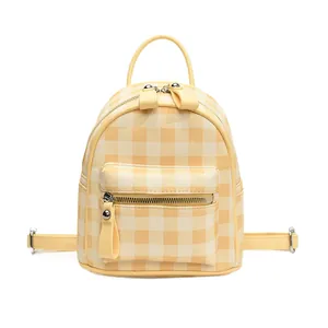 Mini Gingham backpack in yellow and beige checkered pattern with top handle and straps