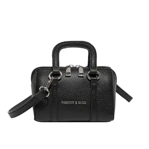Chic black litchi pattern mini Boston bag with silver hardware for hand or crossbody use