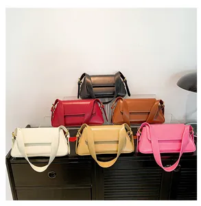 Showcase of minimalist baguette shoulder bags in six various colors on display shelves
