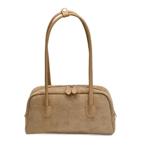 Elegant retro baguette bag in light brown suede finish with minimalist pillow design