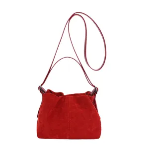 Red matte suede dumpling bag with pleated texture and dual strap design for women