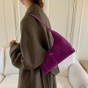 Retro purple litchi texture shoulder bag worn by model in autumn woolen coat