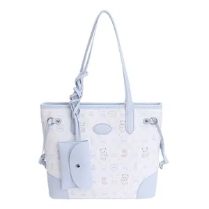 Blue and white contrast bucket bag with cartoon bear pattern and matching coin purse