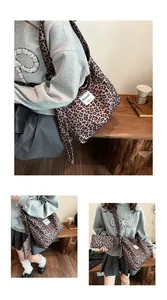 Detail of leopard print canvas tote bag with matching pouch and Muheti brand label