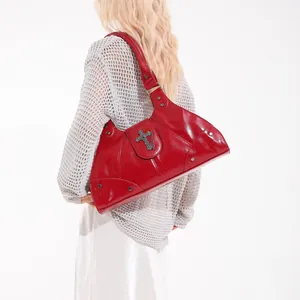 Glossy red punk crossbody bag with metallic cross pendant and studded details