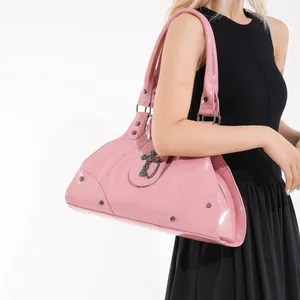Pink patent leather shoulder bag with metallic cross and rivets for punk style