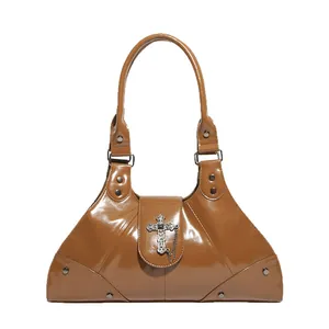 Brown patent leather tote bag with punk cross pendant and silver chain accents