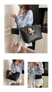 Detail of black monogram tote bag set with small pouch and a cute bear charm