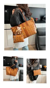 Close-up of brown faux leather tote bag with rabbit print, inner pouch and bear charm