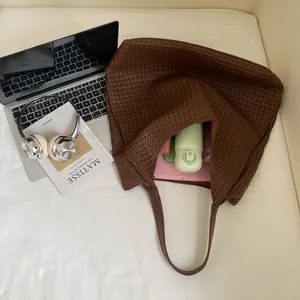 Large dark brown woven tote bag showing spacious interior for tablets and daily essentials