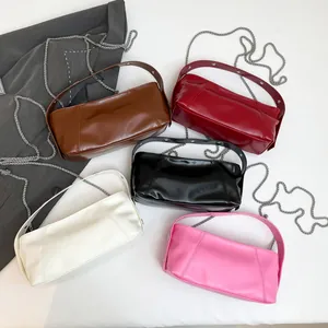 Minimalist large capacity cylinder shoulder bags in shiny patent leather with chain straps