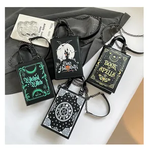 Collection of four gothic Halloween themed hard shell handbags with chain straps and spooky motifs
