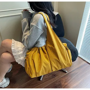Large mustard yellow canvas tote bag shown by a model for daily commuting and travel