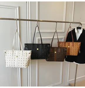 Close-up of stylish tote bags in four colors with rabbit monogram and side drawstrings