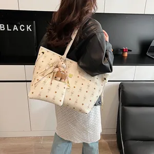 Fashionable beige large tote bag with cute rabbit monogram print and teddy bear charm