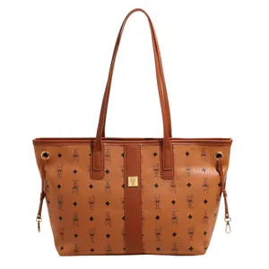 Brown leather tote bag with rabbit patterns and MUMUTI logo, large commuter shoulder bag