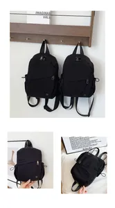 Detalle de mochila de nailon negro con bolsillos de cremallera y bolsillo lateral ajustable