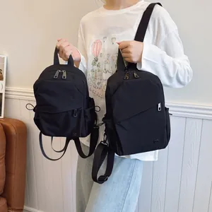 Ensemble sac à dos 3-en-1 en nylon noir avec design imperméable et compartiments multiples