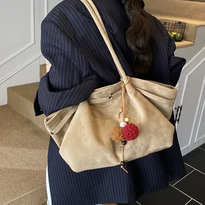Retro khaki suede large capacity tote bag for women featuring a colorful plush charm