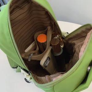 Sac à dos multifonction vert fluo avec doublure rayée et poche intérieure zippée