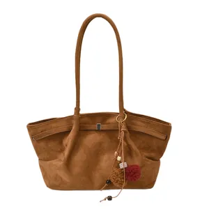 Vintage brown suede oversized tote bag with bohemian tassel charm for women