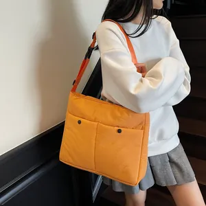 Minimalist orange large capacity crossbody messenger bag with double front pockets for daily commute