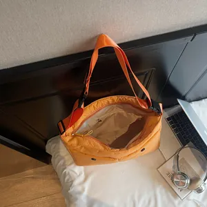 Minimalist bright orange large capacity messenger bag with adjustable shoulder strap