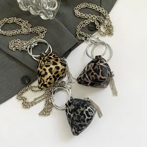 Mini leopard print pyramid bags in three colors with silver ring handles and chain straps