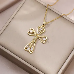 Exquisite gold cross necklace with zircon inlays on a champagne jewelry box