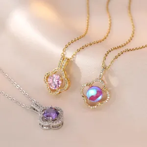 Three elegant stainless steel four-leaf clover pendant necklaces with colorful zircon stones