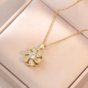 Elegant gold flower necklace with zircon petals showcased in a champagne gift box